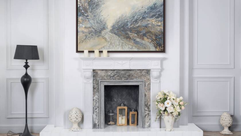 Mockup of "Freedom Awaits the Jewish People" painting hung above a fireplace in a modern living room with minimalist decor.