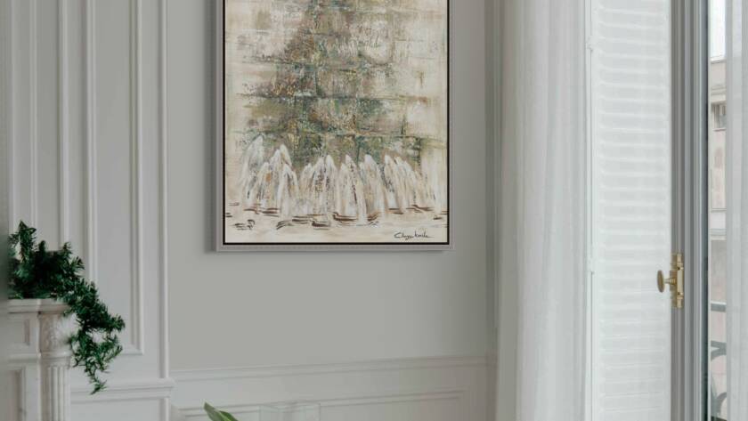 Mockup of "Threads of Time: Tallit and Tradition" painting hung above a modern chair next to a large window in a bright, minimalist room.