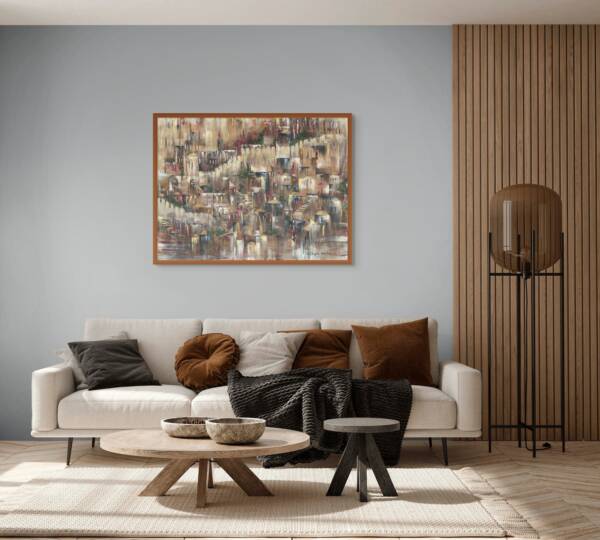 Framed artwork of Jerusalem in earthy tones, hanging above a modern white sofa with a minimal coffee table, next to a window letting in soft natural light.