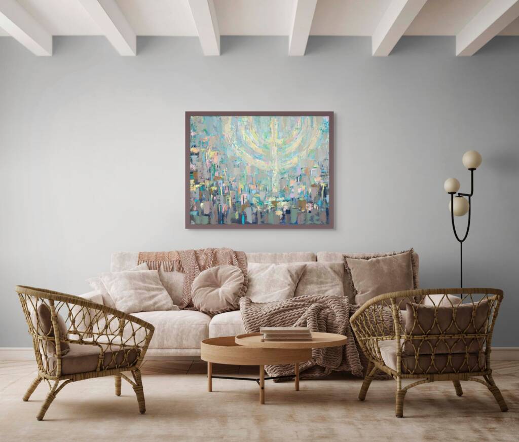 Painting of Jerusalem beneath a softly glowing floating menorah in pastel colors, hanging above a cream-colored sofa with wooden chairs and a wood coffee table in a modern living room.