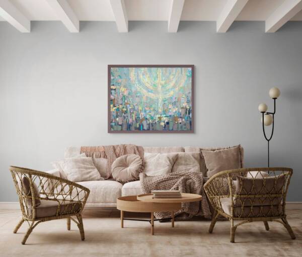 Painting of Jerusalem beneath a softly glowing floating menorah in pastel colors, hanging above a cream-colored sofa with wooden chairs and a wood coffee table in a modern living room.