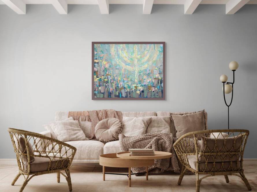 Painting of Jerusalem beneath a softly glowing floating menorah in pastel colors, hanging above a cream-colored sofa with wooden chairs and a wood coffee table in a modern living room.