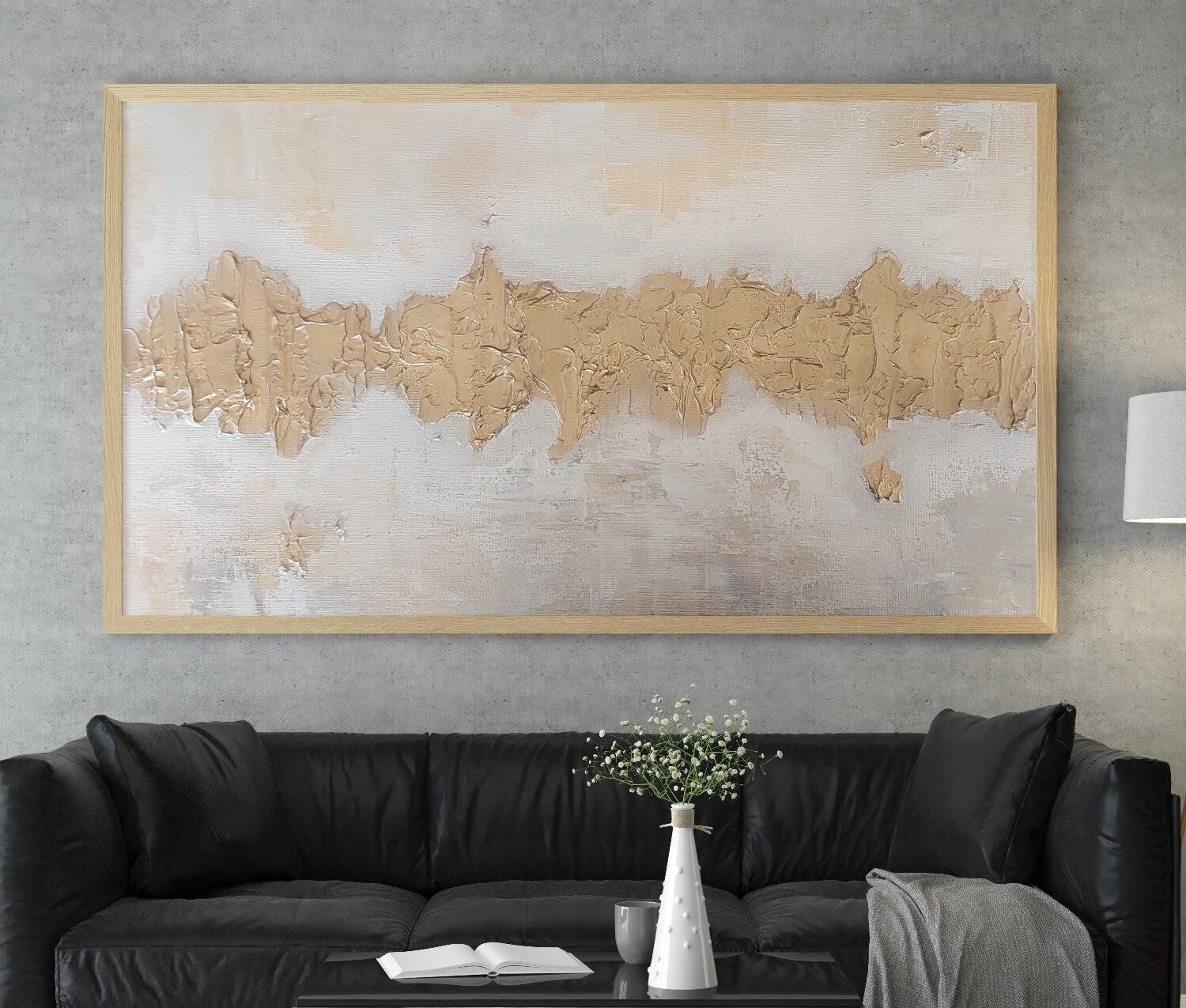 Chaya Koritz's golden abstract painting displayed in a modern living space, showing how Judaica artwork elevates home décor